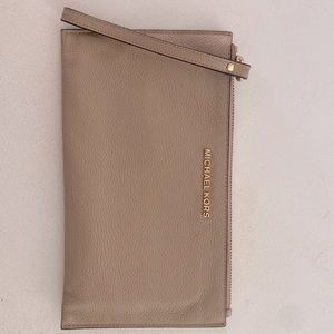 Michael Kors wristlet wallet. Tan/light brown. Great condition. Lightly used.